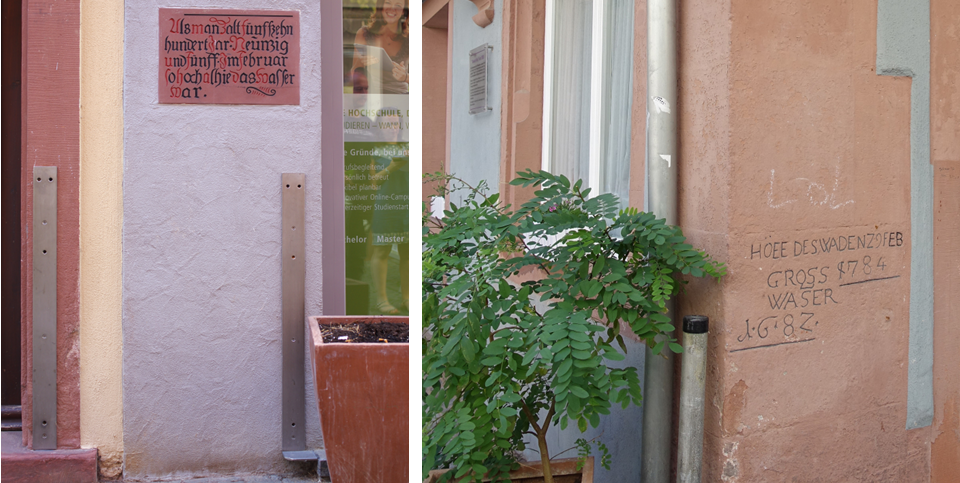 Befestigungsschienen für Hochwasserschutz und eine Hochwassermarke in der Wertheimer Altstadt